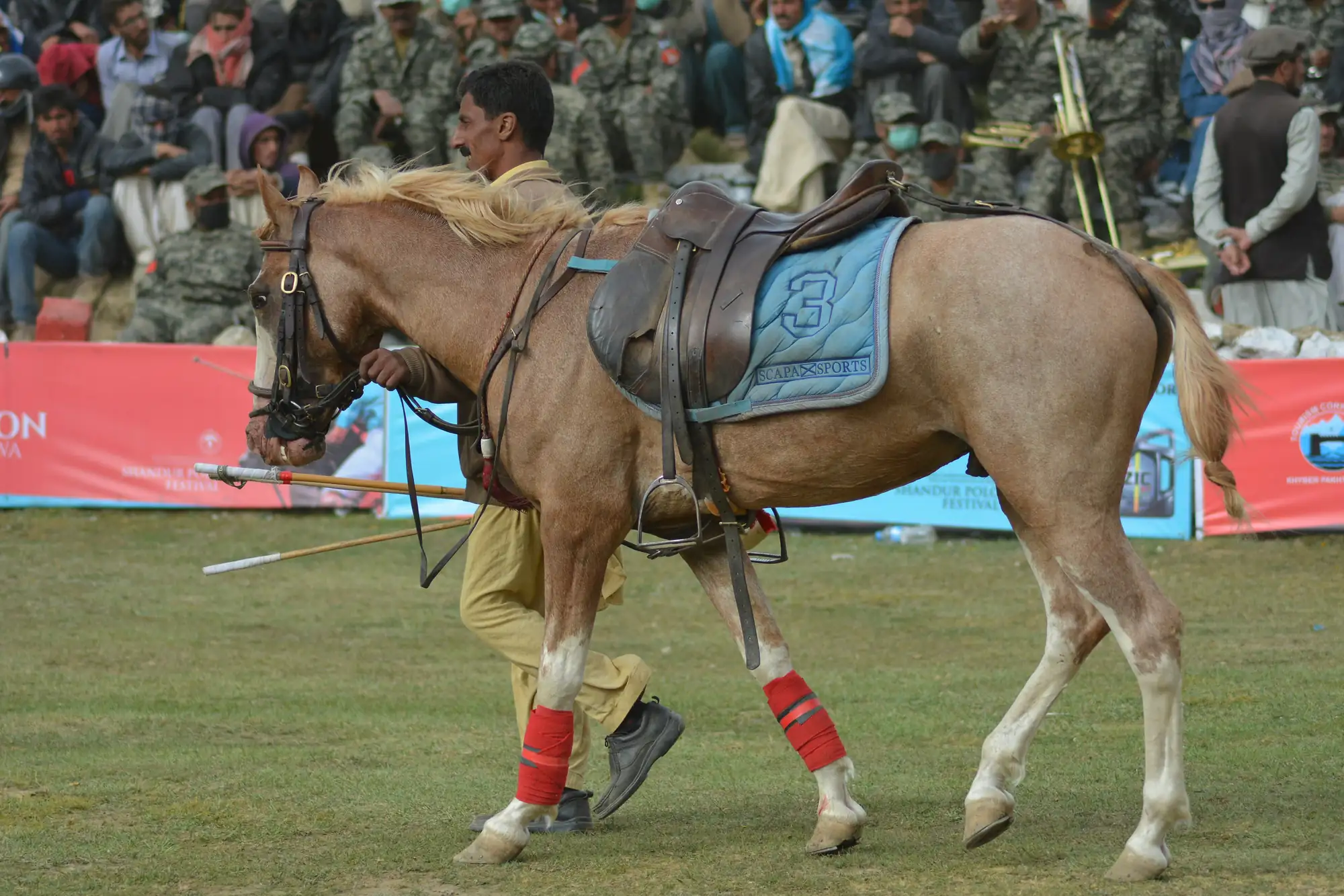 Shandur Polo Festival Match Polo match at Shandur Festival with players on horseback and mountain backdrop in Pakistan