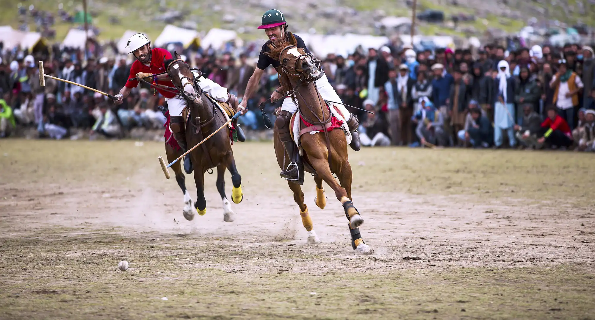 Shandur Polo Festival Action Freestyle polo player on horseback at Shandur Top during the annual polo festival